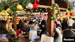 People visit a Christmas market, as COVID-19 outbreaks continue, in Shanghai, China Dec. 24, 2022.