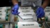 Cakes in the shape of syringes are seen at the Schuerener Backparadies bakery, as the vaccination rollout against the coronavirus disease (COVID-19) continues, in Dortmund, Germany, January 8, 2021.