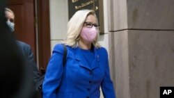 Rep. Liz Cheney, R-Wyo., arrives as House GOP members meet to decide whether she should be removed from her leadership role as chair of the Republican Conference.
