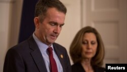 FILE - Virginia Governor Ralph Northam, accompanied by his wife Pamela Northam, speaks during a news conference in Richmond, Virginia, Feb. 2, 2019.