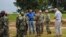 U.S. soldiers and their Liberian counterparts survey a construction site for an Ebola virus treatment center outside Monrovia on Oct. 3, 2014.