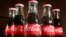FILE- This April 28, 2016, file photo shows bottles of Coca-Cola in Concord, N.H.