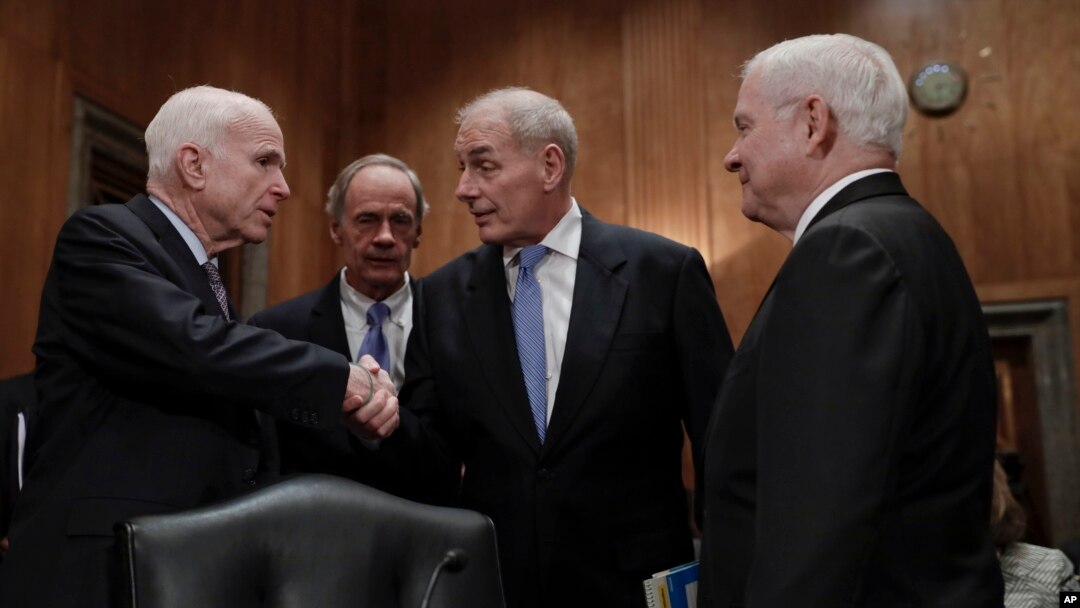 From left, Senate Armed Services Committee Chairman Sen. John McCain, R-Ariz., Sen. Tom Carper, D-Del., Homeland Security Secretary-designate John Kelly, and former Defense Secretary Robert Gates greet each other on Capitol Hill in Washington prior to Kelly's confirmation hearing before the committee, Jan. 10, 2017. 