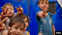 A handful of Mosul children engage with reporters. (J. Dettmer/VOA) 