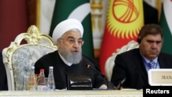 Iranian President Hassan Rouhani delivers a speech at the Conference on Interaction and Confidence-Building Measures in Asia (CICA) in Dushanbe, Tajikistan, June 15, 2019. 