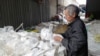 A man sorts plastic waste at Minh Khai Craft Village in Hung Yen province, Vietnam, February 26, 2024.