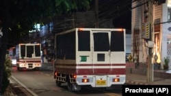 This photo provided by Thailand's daily web newspaper 'Prachatai' shows trucks with black tape covering the windows leave a detention center in Bangkok, Thailand, Feb. 27, 2025.