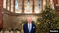 FILE - Britain's King Charles looks on during the recording of his Christmas message at the Fitzrovia Chapel in central London, Dec. 11, 2024. 