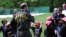A girl scout is reacting during a martial arts session at a Girl Scout camp in Catoctin Park, Maryland. (Photo by Diaa Bekheet)