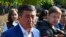 Kyrgyz Presidential candidate Sooronbai Jeenbekov speaks to the media at a polling station in Bishkek, Kyrgyzstan, Oct. 15, 2017. 