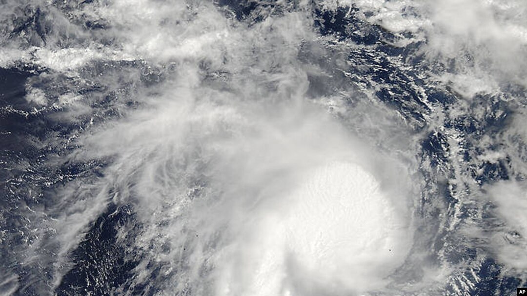 This image from NASA's Aqua satellite and made available by NASA's Goddard MODIS Rapid Response Team shows Cyclone Marcia in the Coral Sea, off the northeast coast of Australia, Feb. 18, 2015.