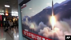 A TV screen shows file footage of North Korea's missile launch during a news program at the Seoul Railway Station in Seoul, South Korea, May 4, 2019.