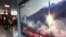 A TV screen shows file footage of North Korea's missile launch during a news program at the Seoul Railway Station in Seoul, South Korea, May 4, 2019.