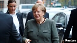 Angela Merkel, leader of the Christian Democratic Union (CDU), arrives at the German Parliamentary Society offices before the start of exploratory talks about forming a new coalition government in Berlin, Nov. 10, 2017. 