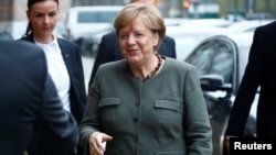 Angela Merkel, leader of the Christian Democratic Union (CDU), arrives at the German Parliamentary Society offices before the start of exploratory talks about forming a new coalition government in Berlin, Germany, Nov. 10, 2017. 