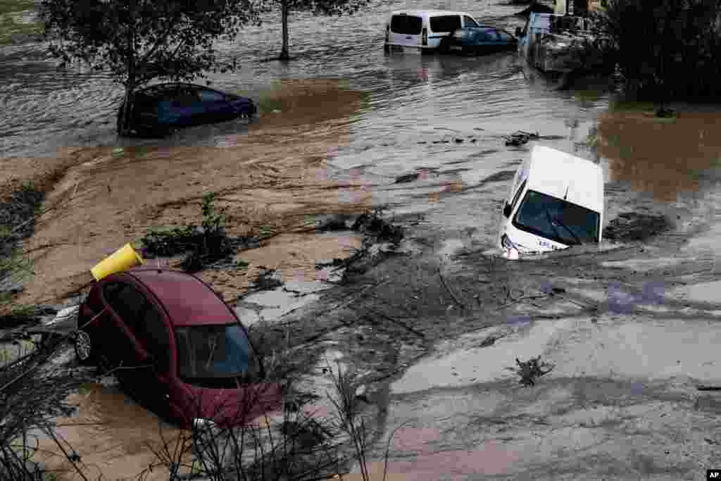 Cars are being swept away by the water, after floods preceded by heavy rains caused the river to overflow its banks in the town of Alora, Malaga, Spain.