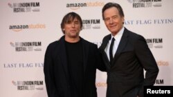 Cast member Bryan Cranston (R) poses with director Richard Linklater as they arrive for the premiere of "Last Flag Flying" during the British Film Institute (BFI) London Film Festival at the Odeon, Leicester Square, in London, Britain, Oct. 8, 2017. 