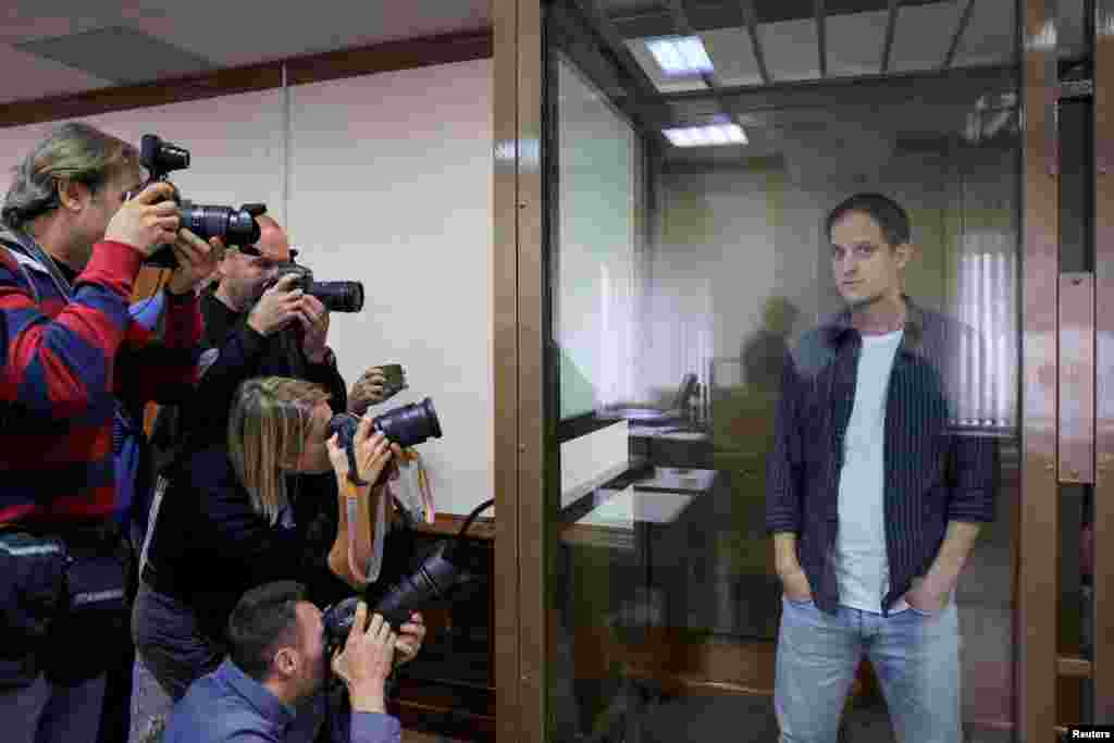 Wall Street Journal reporter Evan Gershkovich stands inside an enclosure for defendants before a court hearing to consider an appeal against his pre-trial detention on espionage charges in Moscow, Russia, Oct. 10, 2023.