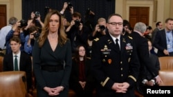 Jennifer Williams, special adviser to Vice President Mike Pence and Lt. Colonel Alexander Vindman, director for European Affairs at the National Security Council, prepare to testify before the House Intelligence Committee, Nov. 19, 2019. 