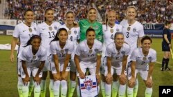 The US team poses prior to their match against Germany in a women's soccer game in the SheBelieves Cup, Wednesday, March 9, 2016, in Boca Raton, Fla. (AP Photo/Joel Auerbach)