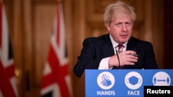 Britain's Prime Minister Boris Johnson speaks on Dec. 19, 2020, during a news conference about a new kind, or strain, of the coronavirus that has been identified in Britain and South Africa. (REUTERS)