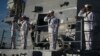 Navy sailors aboard the USS Halsey salute the USS Utah Memorial in Honolulu, Dec. 7, 2016. 