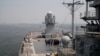 FILE - U.S. Navy sailors gather on the deck of the USS Blue Ridge as it anchors off Manila Bay west of Manila, Philippines, March 13, 2019. The ship's commander renewed an American vow to "sail, fly and operate wherever the law allows us to."