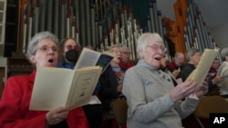 Members of the choir at Central Moravian Church sing at a 'Lovefeast' service in Bethlehem, Pennsylvania, Dec. 1, 2024.