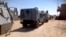 Army officers and soldiers check the area where rocket-propelled grenades hit a bus in El-Arish city, in North Sinai, July 15, 2013. 