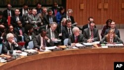 FILE - U.N. Russian Ambassador Vitaly Churkin, far left, listens as U.S. Ambassador to the U.N. Samantha Power, far right, speaks during a meeting of the U.N. Security Council meeting on Ukraine, March 3, 2014, at U.N. headquarters.