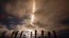 A time exposure shows photographers as they document the SpaceX Falcon 9 rocket with a crew of four as it launches from pad 39A at the Kennedy Space Center in Cape Canaveral, Florida, Sept. 9, 2024. 