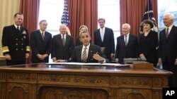 U.S. President Barack Obama signs the new Strategic Arms Reduction Treaty (START) in the Oval Office of the White House in Washington, February 2, 2011. 