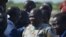 Rebel leader Riek Machar (C) meets with his supporters after landing at Juba international airport on April 26, 2016.
