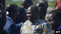 FILE - South Sudan opposition movement leader Riek Machar (C) meets with supporters at Juba international airport, in Juba, South Sudan, April 26, 2016.