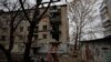 FILE PHOTO: View shows an apartment building damaged by a recent Russian military strike in Kherson