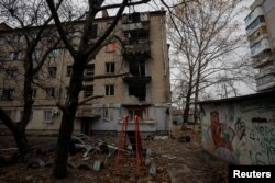 FILE PHOTO: View shows an apartment building damaged by a recent Russian military strike in Kherson