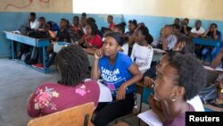 Students attend a class at the College Saint Pierre-Eglise Episcopale D'Haiti as schools and businesses tentatively reopen their doors as anti-government protests wane, in Port-au-Prince, Haiti, Dec. 3, 2019.