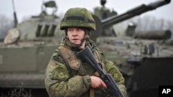 A Russian army soldier takes part in drills at the Kadamovskiy firing range in the Rostov region in southern Russia, Dec. 10, 2021.