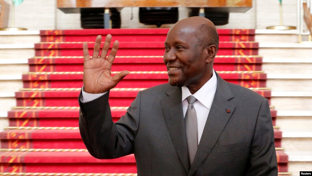 Ivory Coast Prime Minister Daniel Kablan Duncan waves after the resignation of his government in the Presidential Palace in Abidjan, Ivory Coast, Jan. 9, 2017. President Alassane Ouattara has named him vice president, a new post created under a constitution approved by referendum late last year.