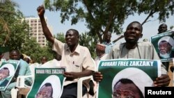 FILE - Protesters hold banners calling for the release of Sheikh Ibrahim El-Zakzaky, the leader of the Islamic Movement of Nigeria, in Abuja, Nigeria, Jan. 26, 2018.