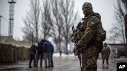 A Ukrainian soldier patrols the area around the humanitarian aid center in Avdiivka, Ukraine, Feb. 4, 2017.