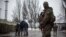 A Ukrainian soldier patrols the area around the humanitarian aid center in Avdiivka, Ukraine, Feb. 4, 2017.