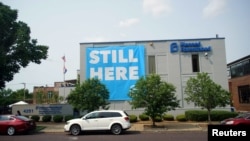 FILE - A banner stating "Still here" hangs on the side of the Planned Parenthood building in St. Louis, Missouri, May 31, 2019. 