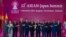 FILE - Japan Prime Minister Shinzo Abe poses for a group photo with ASEAN leaders during an ASEAN-Japan summit in Nonthaburi, Thailand, Nov. 4, 2019.