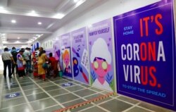 People register their names to receive a coronavirus vaccine at a free camp in Kolkata, India, June 14, 2021.