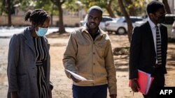 Freelance journalist for the New York Times, Jeffery Moyo, center, leaves the Bulawayo prison in Bulawayo, Zimbabwe, June 16, 2021.