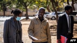 Freelance journalist for the New York Times, Jeffery Moyo, center, leaves the Bulawayo prison in Bulawayo, Zimbabwe, June 16, 2021.