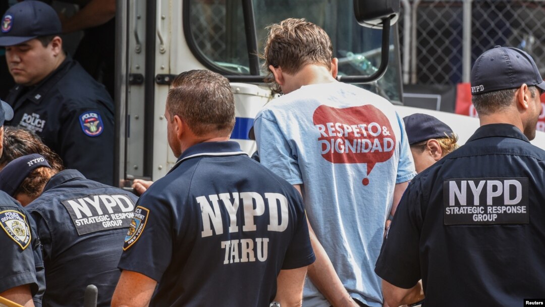 A person from the group called "Make the Road" is detained while protesting in support for the Deferred Action for Childhood Arrivals or DACA during the United Nations General Assembly in New York City, Sept. 19, 2017.