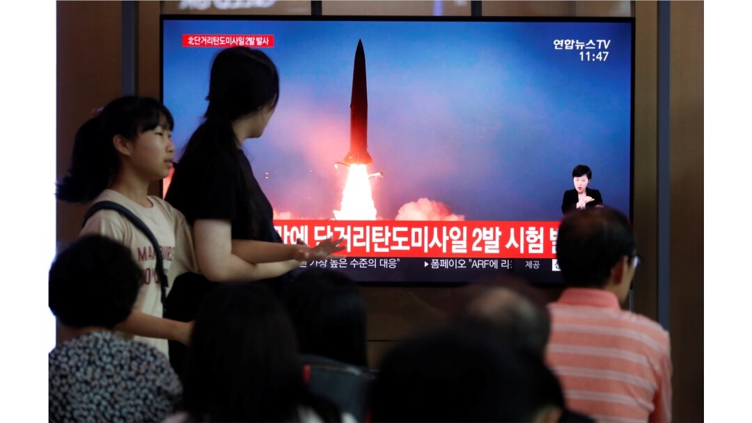 People watch a TV that shows a file picture of a North Korean missile for a news report on North Korea firing short-range ballistic missiles, in Seoul, South Korea, July 31, 2019.
