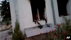 Associated Press video footage of the burned-out hospital compound in the east of Kunduz city allegedly shows automatic weapons on windowsills.